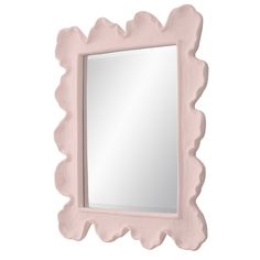 a pink mirror with scalloped edges on a white wall