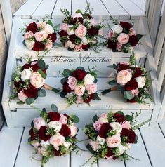 wedding bouquets arranged on top of an old wooden crate