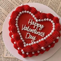 a heart shaped cake with the words happy valentine's day written on it