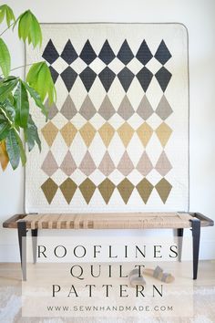 a table with a potted plant next to it and the words rooflines quilt pattern on