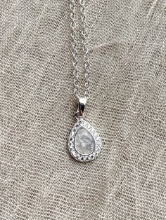 Gorgeous sterling silver pendant with CZ crystals, set with the ashes of your loved ones.  Ashes are set with high quality synthetic opals and industry leading resin.  Comes with 18in chain.  Please follow instructions here for sending ashes: https://www.orphictreasures.co.uk/post/how-to-send-inclusions-memorial-jewellery Silver Teardrop Birthstone Necklace For Gift, Silver Teardrop Pendant Birthstone Necklace, Silver Engraved Birthstone Necklace Keepsake, Engraved Silver Birthstone Necklace For Keepsake, Silver Birthstone Teardrop Pendant Crystal Necklace, Engraved Silver Birthstone Necklace Keepsake, Silver Teardrop Pendant Crystal Necklace Gift, Silver Teardrop Pendant Crystal Necklaces For Gifts, Silver Pendant Birthstone Necklace For Wedding