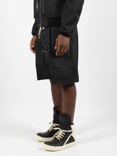 Rick Owens cotton canvas cargo bermuda shorts. - SS24 - Regular fit - Elasticated drawstring waistband - Zip on the front - Side pockets - Patch cargo pockets - Made in Italy - 97% Cotton 3% Elastane | Rick Owens Men's Cargobela Shorts in Black | SS24 Utility Cargo Shorts With Drawstring, Utility Shorts With Drawstring For Streetwear, Utility Style Drawstring Shorts For Streetwear, Utility Drawstring Shorts For Streetwear, Knee-length Cotton Bermuda Shorts With Belt Loops, Cotton Cargo Shorts With Drawstring, Black Cotton Bermuda Shorts With Side Pockets, Utility Shorts With Drawstring, Utility Style Short Bottoms With Drawstring