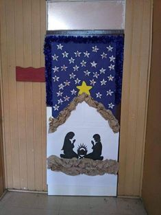 a door decorated to look like a nativity scene