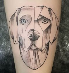 a dog's face is shown on the thigh with geometric shapes around it, as well as an eye