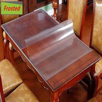 there is a glass table and chairs in this dining room set with wood flooring