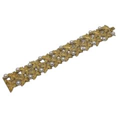 18k yellow gold bracelet, crafted by Buccellati, featuring leaves and 6.5mm pearls DESIGNER: Buccellati MATERIAL: 18K Gold GEMSTONE: Pearl DIMENSIONS: Bracelet is 7 3/8" long and 30mm wide WEIGHT: 48.3g MARKED/TESTED: Italy, 18k, V746, Buccellati CONDITION: New PRODUCT ID: IN843 Buccellati Jewelry, Leaf Motif, Art Nouveau Design, Yellow Gold Bracelet, Leaf Necklace, Mariah Carey, Stunning Jewellery, Rose Cut Diamond, Jewelry Designs