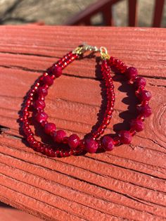 This elegant bracelet is made with red faceted beads and red glass beads on flexible beading wire with a gold toggle clasp. It measures approximately 8 inches long. This bracelet was made and designed by myself, and there are several more in my shop! I can take custom requests, sizing, colors, etc. Feel free to send a message with any questions or requests! <3 Red Crystal Bracelet With Spacer Beads, Adjustable Red Czech Glass Bracelets, Adjustable Red Czech Glass Bracelet, Red Faceted Beaded Bracelets For Gifts, Red Czech Glass Beaded Bracelets With Colorful Beads, Red Czech Glass Bracelets With Colorful Beads, Red Czech Glass Beaded Bracelets, Red Czech Glass Bracelet With Round Beads, Handmade Red Czech Glass Beaded Bracelets