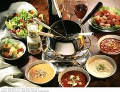 a table topped with lots of different types of food and condiments on top of it