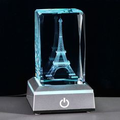 PRICES MAY VARY. 🔷Materials & Size - Crystal glass Eiffel tower size: 2''x2''x3.14", 3D stereoscopic display, made with High-quality K9 Crystal, it's clear without bubble inside, making the Eiffel tower figurine more transparent and glossier 🔷The Colorful Patterns - Equipped with a black LED light base, allowing the crystal cube to present various colors, looks more cute and beautiful, powered by AAA batteries or USB cable line, can be used as Eiffel tower lamps for bedroom 🔷Excellent Gift - Paris Themed Bedroom Decor, Eiffel Tower Lamp, Eiffel Tower Decor, Paris Party Decorations, Bedroom Ornaments, Eiffel Tower Decorations, Paris Gifts, Bedroom Office Decor, 3d Illusion Lamp