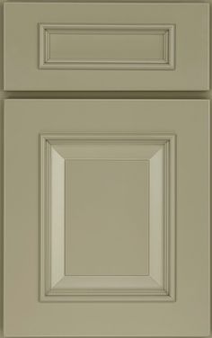 an image of a kitchen cabinet door with no drawer knobs on the front and bottom