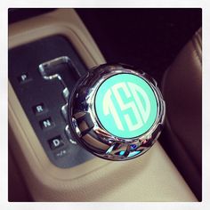 an automatic gear stick with the letter g on it's center console in a car