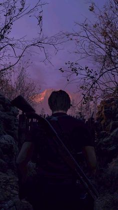 a man is walking up a hill with his back to the camera