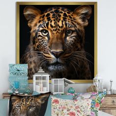 a leopard is looking at the camera while sitting in front of some pillows and other items