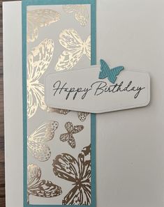 a close up of a birthday card with butterflies