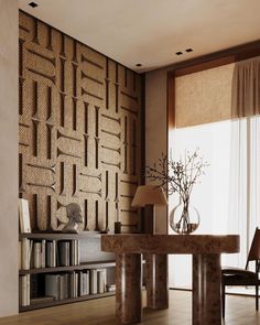 a living room filled with furniture and a large wall papered design on the wall