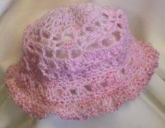 This very soft lacy crocheted hat is a perfect stylish head cover. The circumference (measured around the head just above the ears) is 20 - 22 inches, fitting an average teenage/adult head. Custom orders are always welcome so please feel free to contact me with your special requests. Pink Adjustable Brimmed Cloche Hat, Pink Brimmed Cloche Hat One Size, Pink Brimmed Cloche Hat, One Size Fits Most, Pink Beanie Mini Hat For Spring, Handmade Pink Cap Sun Hat, Handmade Adjustable Pink Bucket Hat, Handmade Pink Hat With Short Brim, Spring Adjustable Beanie Hat, Pink Adjustable Crochet Hat With Curved Brim