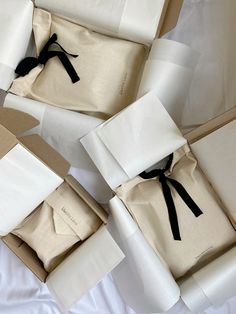 several boxes with white and black paper wrapped around them