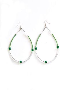 Green Beaded Hoops These earrings are super cute & made from a mix of greens, clear & India silver beads. They are lightweight and have the hook style post. Length does not include hook. Length: 3.75 in, width: 2.5 in Native Made Made in the USA. Indian Beadwork, Long Drop Earrings, Bead Work Jewelry, Beaded Hoops, Green Bead, Jewelry Earrings Hoops, Silver Beads, Bead Work, Oregon