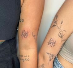 two people with matching tattoos on their arms