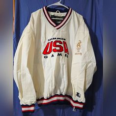 Vintage Never Worn Atlanta Olympic Games Trainer, 1996 Summer Games Usa Pullover Xxl Jacket, By Starter. This Unisex Adult Pullover Has Never Been Worn (But No Tags) And Has Been Stored In A Plastic Covering To Keep It Fresh And Clean. It Has A Little Yellowing On The Sleeves Due To Not Being Exposed. It's A Rare White With Usa Red White And Blue Logo And Cuffs. 100% Nylon And 100% Polyester Lining And Trim. Available Only In Xxl. A Must Have For Your Olympic Sports Memorabilia Collection! Vintage White V-neck Outerwear, Thrift Board, Team Usa Olympics, Atlanta Olympics, Brand Aesthetic, Windbreaker Jacket Mens, Half Zip Jacket, Black Windbreaker, Olympic Sports