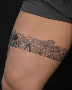 a person with a tattoo on their thigh