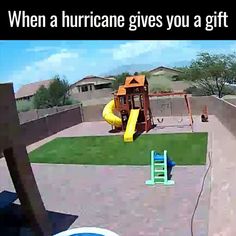 a child's play area with a slide, swing set and pool in the background