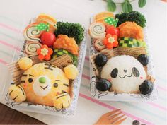 there are two small trays with food on them that look like cats and panda bears