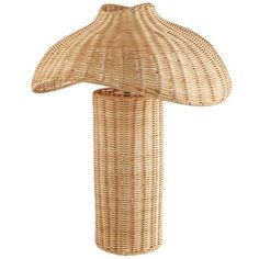 a wicker table lamp with a large shade on it's top and bottom