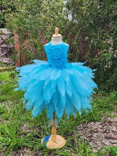 Welcome to Baby/Infants Clothing  by Funkids&Us Boutique Blue Bird Costume    tutu  dress is super cute and adorable it is perfect for  birthdays, photographs, Halloween party  or everyday dress up.dress up!  This tutu dress is made premium tulle of of turquoise, triple layered tulle strand skirt with blue feather on the bodices.  Include Underneath top lining.  All items are made in smoke free home, and are handcrafted by me personally. Cheap Blue Fitted Tutu Dress, T Bird Baby Costume, Blue Bird Costume, Fotos Halloween, Feather Tutu, Dress Bird, Costume Tutu, Birthday Tutu Dress, Girls Costumes