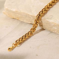 Crafted with an intricate wheat chain design, this bracelet combines the durability of 18k gold plating with a refined aesthetic. Its elegant, intertwined links offer a sophisticated touch to both casual and formal ensembles. Refined Aesthetic, Traditional Weaving, Contemporary Chic, Chain Design, Gold Plating, Chain Bracelet, Wheat, My Jewellery, Free Gifts