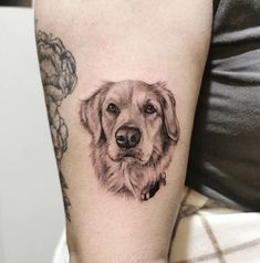 a black and white photo of a dog's face on the right arm,