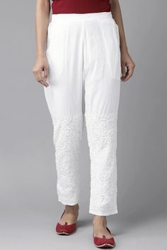 White Pure Cotton Hand Embroidered Chikankari Pants With Pockets are perfect for any occasion. Made of pure cotton fabric, these pants are soft and skin friendly, making them comfortable to wear. Length 38" Half elastic and flat front waist Cotton Handwork Chikankari embroidery Dry Clean Disclaimer: Since the product is hand embroidered, Motifs may vary slightly from image. Chikankari Pants, Phulkari Pants, Lucknowi Kurta, Gharara Suits, Patiala Salwar Suits, Chikankari Embroidery, Bridal Dupatta, Phulkari Dupatta, Chikankari Suits