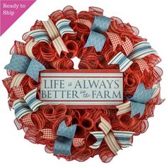 a life is always better at the farm wreath with ribbon and bow ties on it