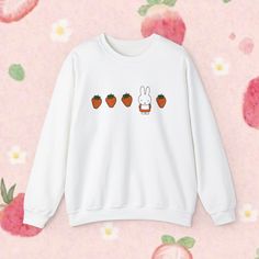 You WILL get stopped in the street and asked where you got this crewneck. Trust me it has happened multiple times haha. Miffy and strawberries = cuteness overload.  Ideal for any occasion, this unisex heavy blend crewneck sweatshirt is pure comfort. These garments are made from polyester and cotton. This combination helps designs come out looking fresh and clean. The collar is ribbed knit, so it retains its shape even after washing. There are no itchy side seams on these sweaters.  Materials/Mor Miffy Sweater, Miffy Clothes, Miffy Strawberry, Japanese Shirt, Girly Outfits, Cuteness Overload, Sew-in Labels, Trust Me, Crewneck Sweatshirt