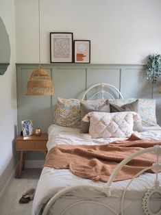 a bed with pillows and blankets on top of it