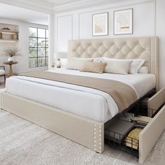 a bedroom with a large bed and drawers in it