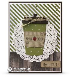 a card with an apple cider on it and doily around the edge that says hello fall