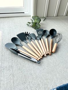 the kitchen utensils are laid out on the floor