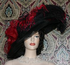 "Introducing East Harbor Angel's stunning Black & Red Edwardian Style Derby Hat \"Mademoiselle Sabine\" designed by Darna! This is the perfect hat for anyone who is looking to add a touch of glamour and sophistication to an event. From the Kentucky Derby to any other special occasion, this derby hat will make heads turn in admiration! With a wide brim black sinamay base, this hat is the perfect addition to any fancy outfit with its luxurious red and black tinged millinery rose and black sinamay Edwardian Tea Party, Kentucky Derby Fashion, Tea Hat, Edwardian Hat, Derby Fashion, Tea Hats, Royal Ascot Hats, Rose Hat, Ascot Hats