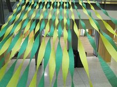 green and yellow streamers are hanging from the ceiling