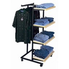 an ironing rack with jeans and shirts on it's sides, holding clothes