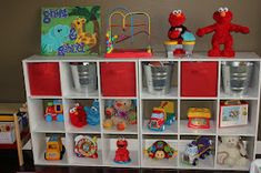 a toy storage unit with stuffed animals and toys