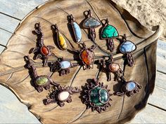 a wooden table topped with lots of different colored stones