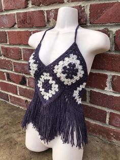 Handmade crochet halter tank top, composed of plum purple and tweed cream colored granny squares and bordered with fun fringe! (very fine and super soft yarn) One-of-a-kind freehanded pattern! Very stretchy and adjustable and fits a variety of different sizes and shapes. Also made with thick and sturdy double back ties and neck ties. Perfect for spring, summer, concerts, raves, festivals or just everyday wear! Photos taken in natural lighting Purple Bohemian Crochet Top For Festival, Purple Bohemian Crochet Lace Top, Cream Granny Square, Summer Concerts, Festival Crop Tops, Womens Halter Tops, Halter Tank Top, Crochet Halter, Bralette Crop Top