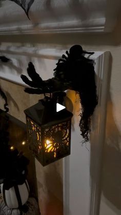 a lantern hanging from the side of a door