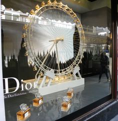 a large ferris wheel sitting inside of a store window