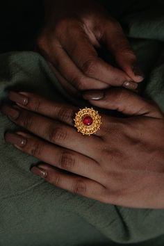 Intricate round stud ring with Ruby gemstone. This ring is adjustable to fit all sizes. Color: Pink Material: 22K gold on brass Quantity: 1 Wash & Care: To decrease the chances of wearing out, here are easy ways on keeping the luster of your gold plated jewelry: 1. Do not spray on perfume or other sprays while wearing your gold plated jewelry. 2. Wait until your lotion or cream is dry or has been absorbed by your skin before you wear your gold plated ring, bracelet or necklace. 3.Substances like Ring With Ruby, Polish Remover, Nail Polish Remover, Silk Roses, Cotton Ball, Pink Ring, Plated Ring, Gold Plated Rings, Ruby Gemstone