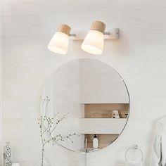 a bathroom with a sink, mirror and lights