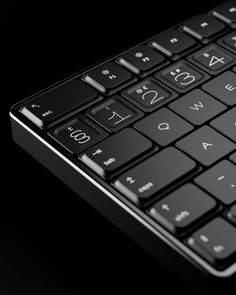 a close up view of a black keyboard with numbers on it's backlit keys