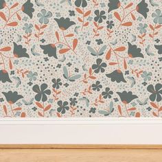 an image of a wallpaper with flowers and leaves on the wall in front of it